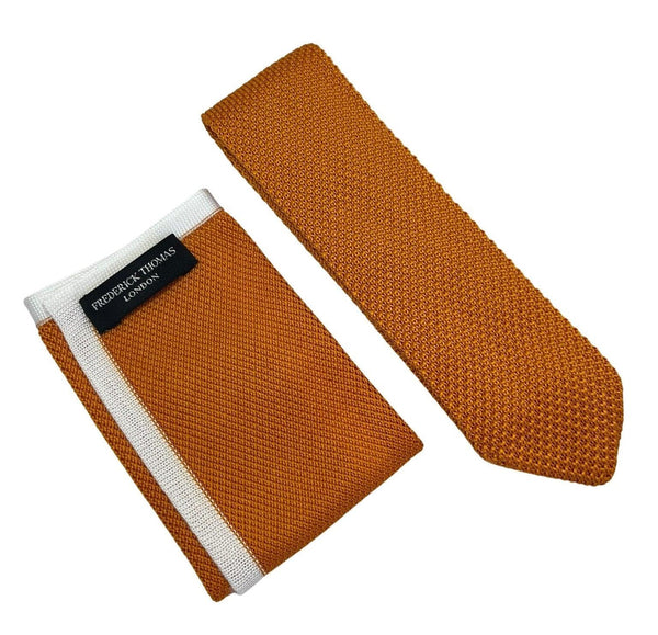 Matching orange knitted pointed end tie and pocket square